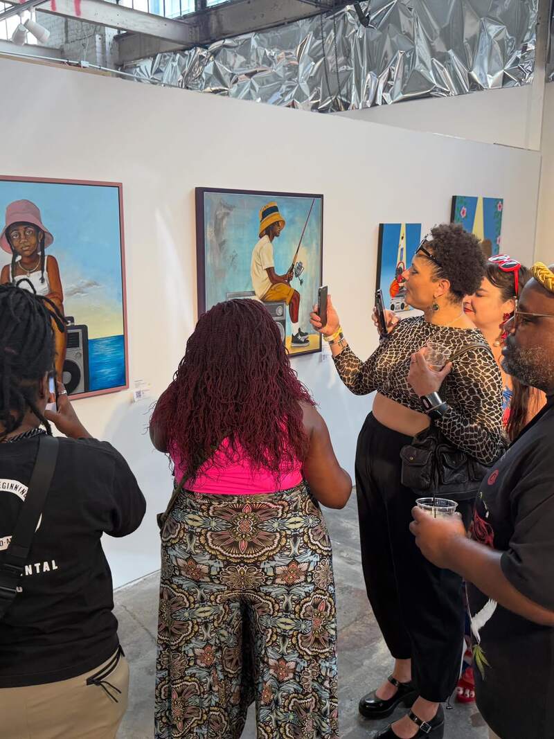 Visitors viewing and photographing Fishing for Ideas at BUTTER