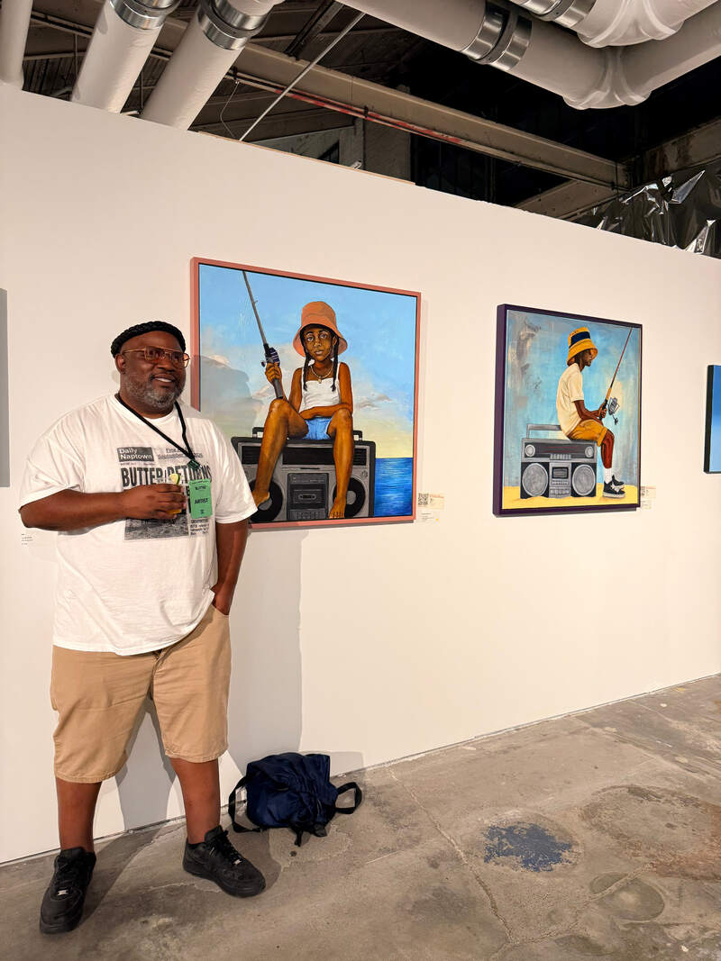 Omar Rashan standing beside both Fishing for Ideas paintings at BUTTER